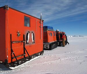 Colbeck hut refurbished in bright ANARE orange paint and on the move as it is towed back out to Colbeck