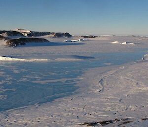 A typical view of the terrain at Ledinghams Depot with frozen bays of sea ice separating the rocky outcrops