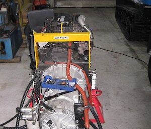 The newly repaired engine sitting on the workshop floor