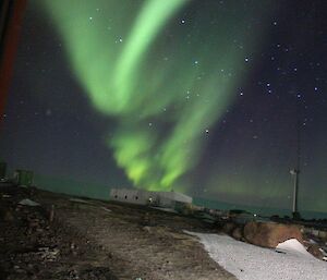 An aurora streaking above the aeronomy building as taken from Lydia’s bedroom window