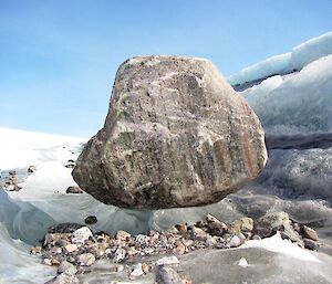 A boulder suspended in ice