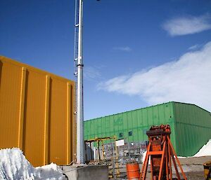 Antenna mast on plinth which has Husky paw prints