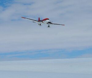 The Basler plane is seen coming in for a landing as it approaches from beyond the plateau