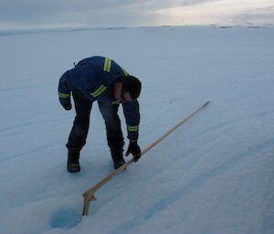 Chris checking out a cane which has a break near the base and wondering if he could cut it off and re-use it?