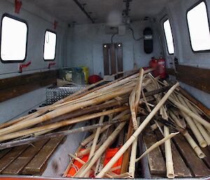 Back of a Hägglunds filled with old canes that have been removed and are to be returned to station where they'll be burnt in the stations waste incinerator which is named ‘Warren'