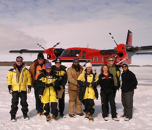 The Twin Otter passengers with their pilots on the sea ice at Mawson