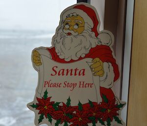 Sign asking Santa to stop at Mawson