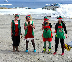 Four female expeditioners dressed as elves