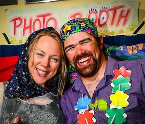 Two expeditioners pose in the photo booth