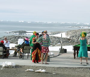 Pool table set up on the helicopter pad and expeditioners playing pool