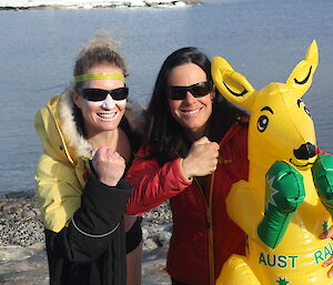 Two female expeditioners with a blow up kangeroo waiting to take the plunge