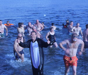 An expeditioner who swam in a penguin suit