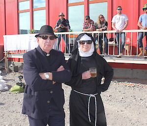 Two expeditioners dressed up as a priest and a nun