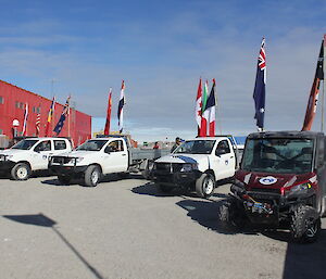 A number of ute vehicles adorned with flag poles for the Australia Day parade