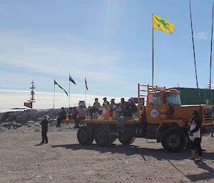 Expeditioners sitting on the back of a truck