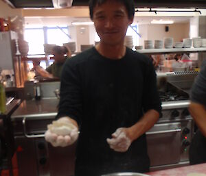 An Chinese expeditioner making dumplings