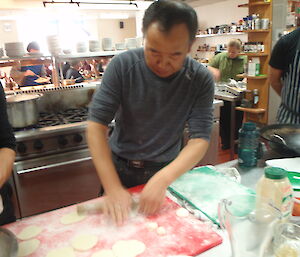 A Chinese expeditioner making dumplings