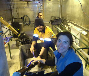Expeditioners cleaning the hydroponics shed