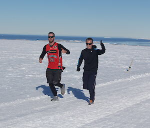 Two runners on the snow track