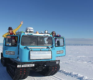 Two expeditioners in a hagglund vehicle