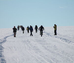 A group of expeditioners on the snow track