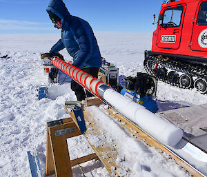 Extracting the snow core from the drill bit