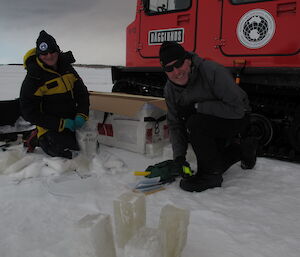 Two scientists with their ice samples
