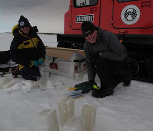 Two scientists with their ice samples