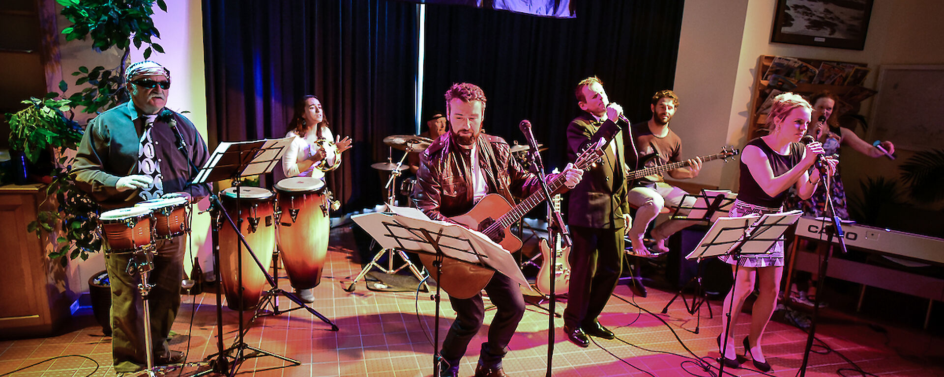 The station band consisting of five men and three women, performs at Casey