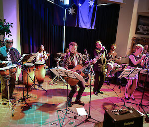 The station band consisting of five men and three women, performs at Casey