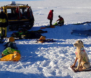 Station mascot, plastic dog Stay, in front of ice hole