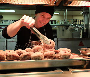 Station chef prepares donuts