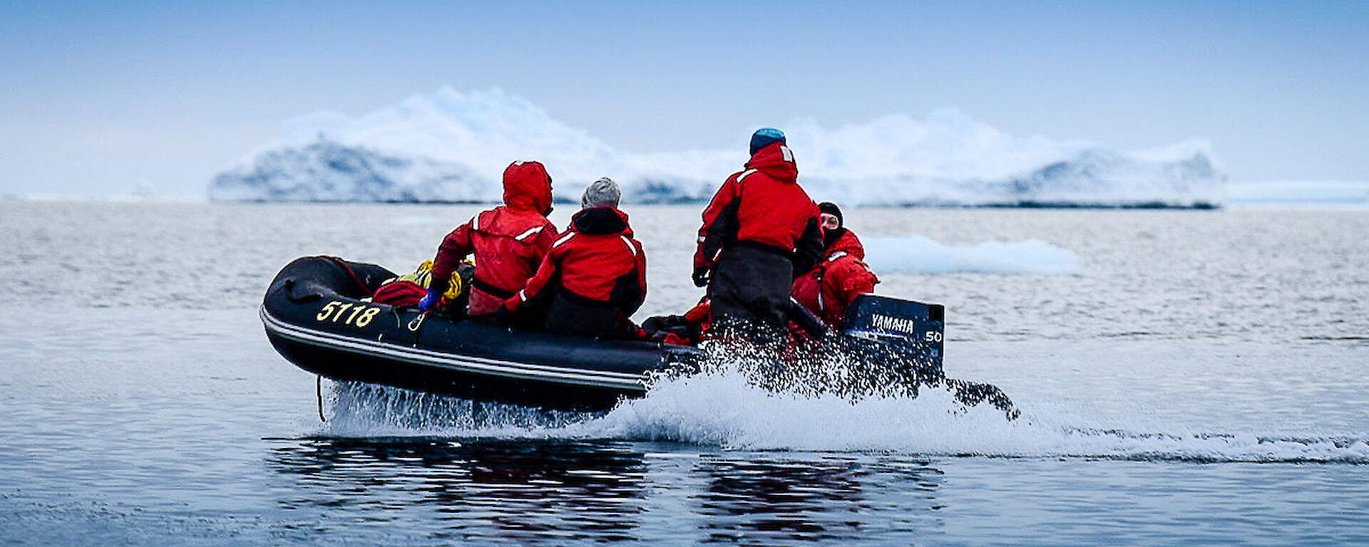 Expeditioners on boats to check out icebergs