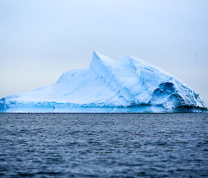 Iceberg surrounded by water — looks very cold