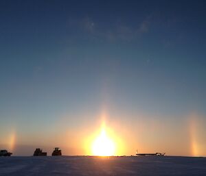 sun refracted in atmosphere looks like two rainbows