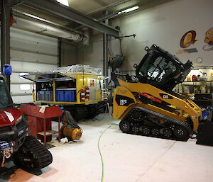 Mechanics workshop at Casey station showing small tracked digger