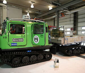 Hägglunds tracked vehicle inside workshop