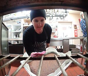 Station chef prepares a cake