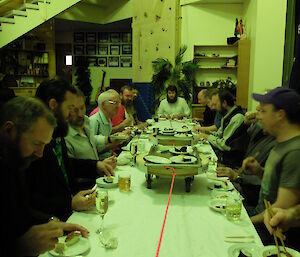 Expeditioners enjoying sushi train