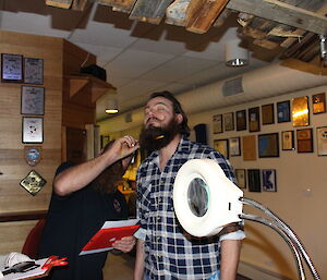 Expeditioner having beard judged by a pencil being inserted into beard