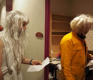 Expeditioners dressed as women rehearse for for the play ‘Cinderella'.