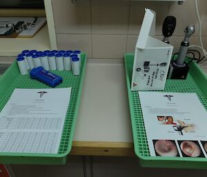 Medical gear on display including hand-held lung capacity tester.