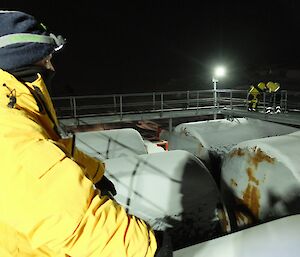 Station leader looking over fuel farm.