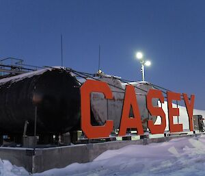 Lower station fuel tanks sit behind very tall letters spelling out the word ‘Casey'.