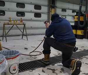 Expeditioners take aim with toy gun at targets