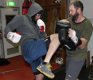 Expeditioner practising his kick-boxing moves in the gym