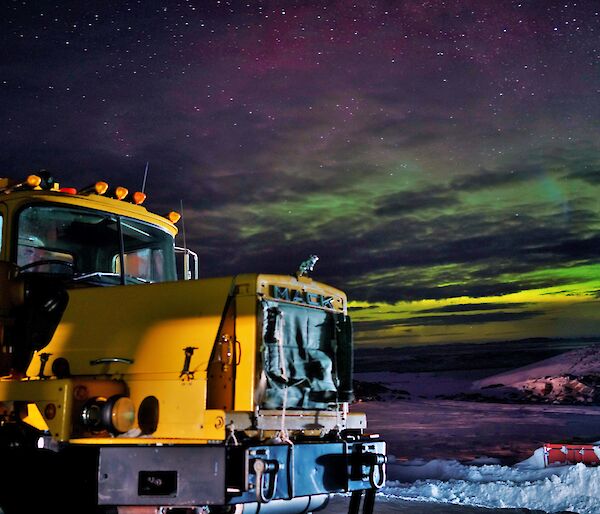 Aurora with large Mack truck in foreground