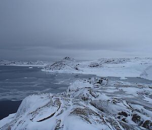 Light snow cover on peninsula rocks