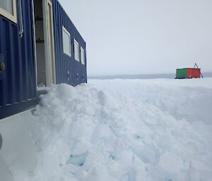 Ice shoveled from building