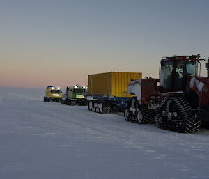 Tractor, fuel trailer and hagg vehicles on route to Wilkins aerodrome